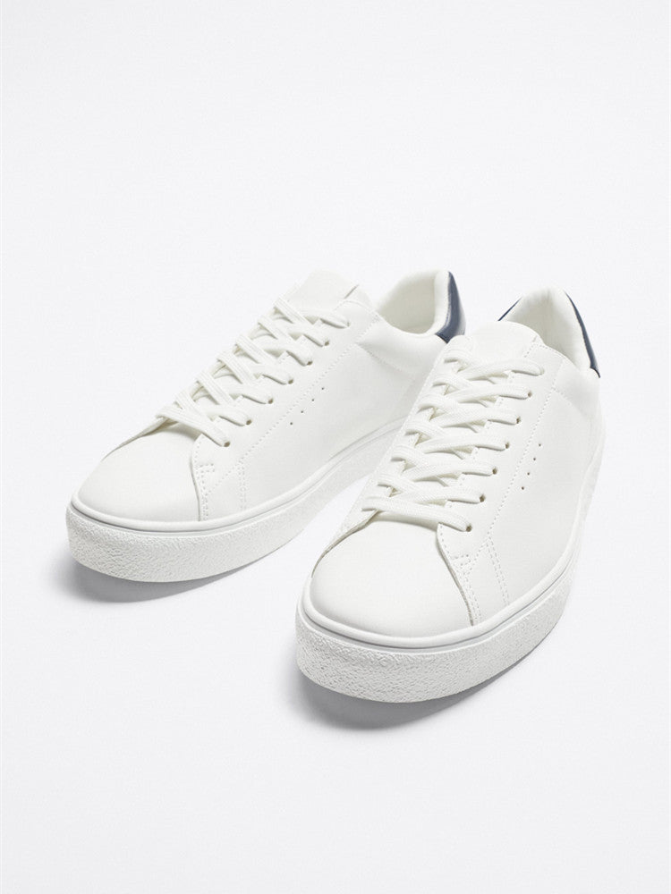 The Everyday White Sneaker — Navy Heel