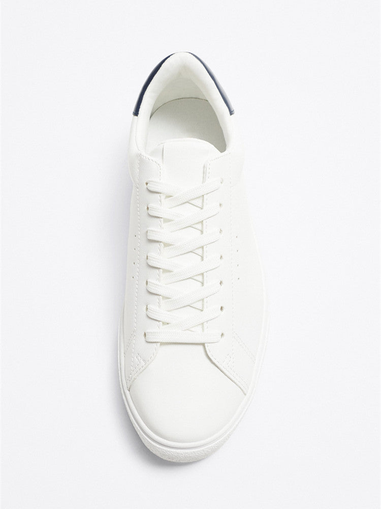 The Everyday White Sneaker — Navy Heel