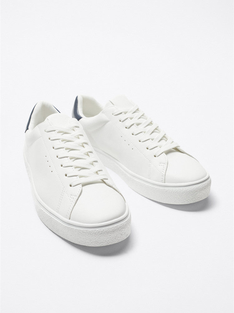The Everyday White Sneaker — Navy Heel