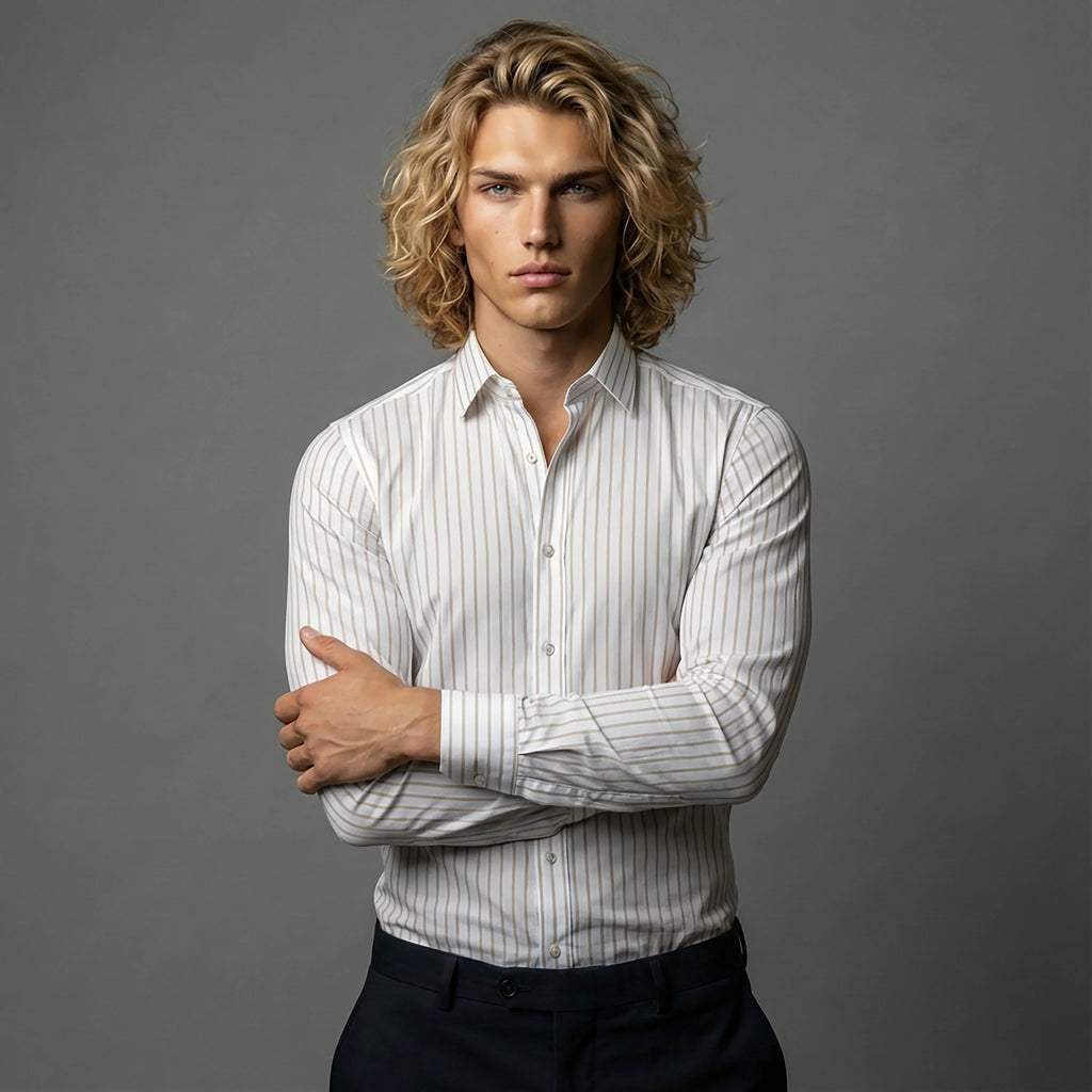 Man in white striped dress shirt with crossed arms, DGMAH fashion studio shoot